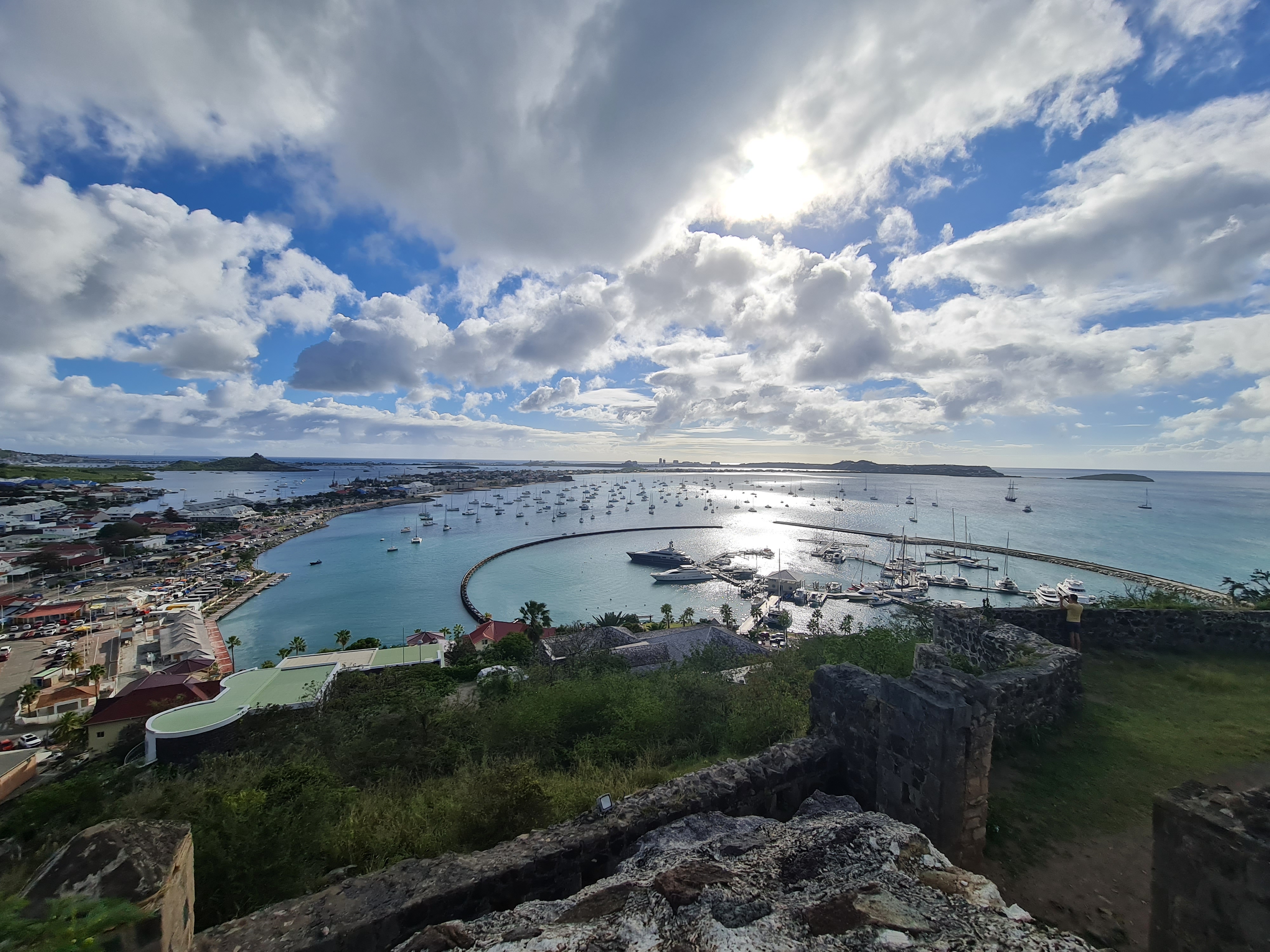 Boats at anchor in a Caribbean bay, viewed from a hilltop fort